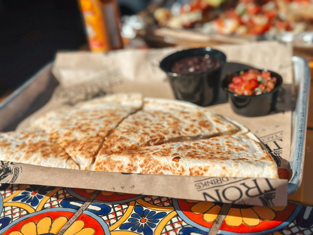 Stock photo of a large quesadilla with salsas